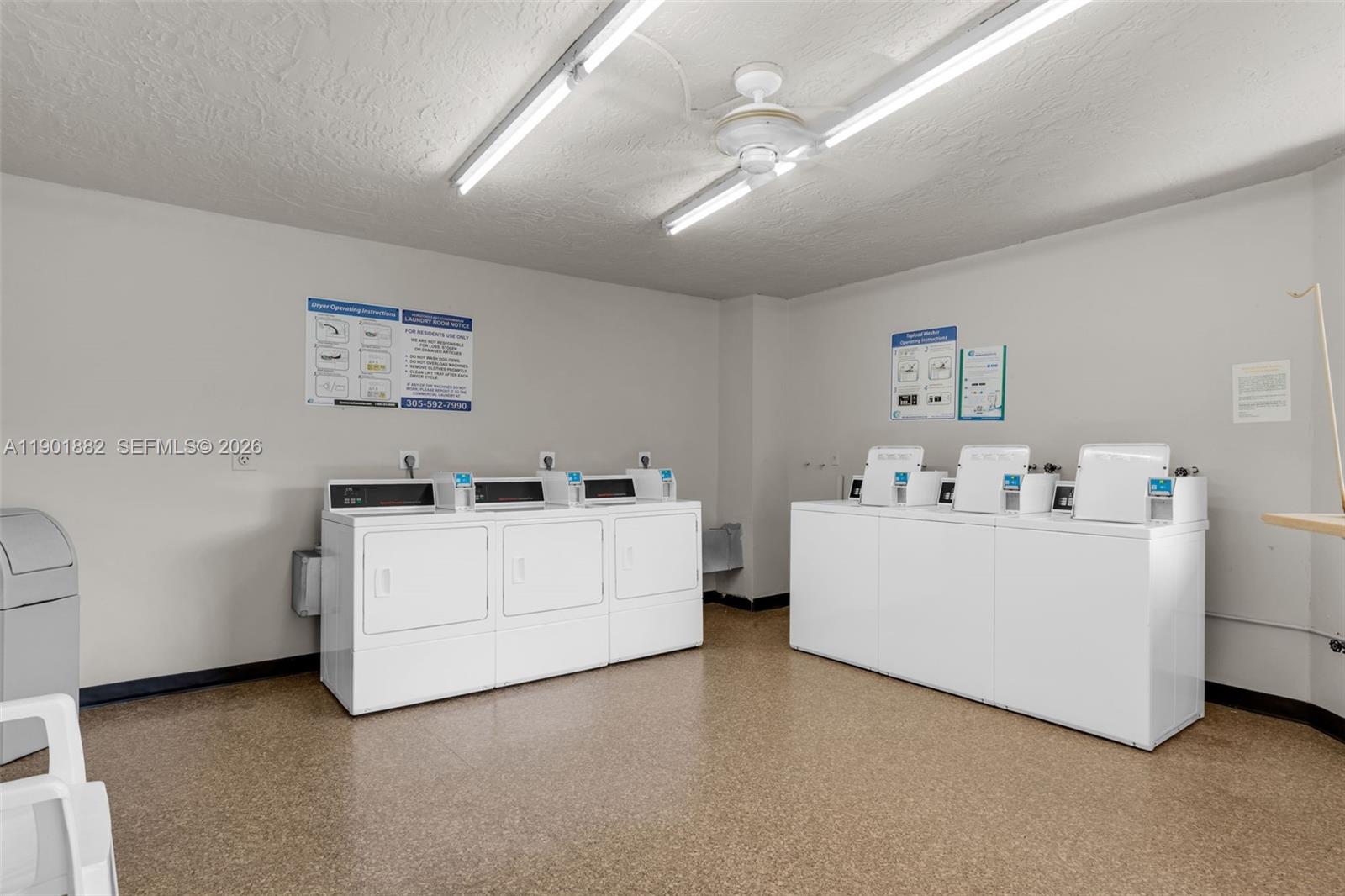 8045 Southwest 107th Avenue, Unit 303 Miami, FL 33173 - Photo 20 of 37 a view of cabinets and washer