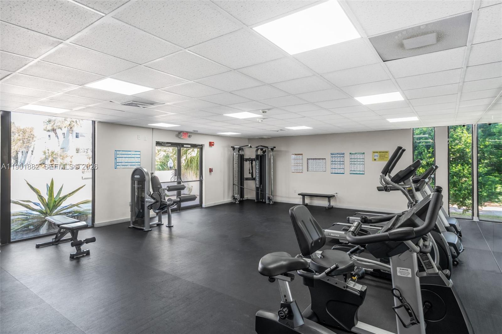 8045 Southwest 107th Avenue, Unit 303 Miami, FL 33173 - Photo 21 of 37 a view of a room with gym equipment