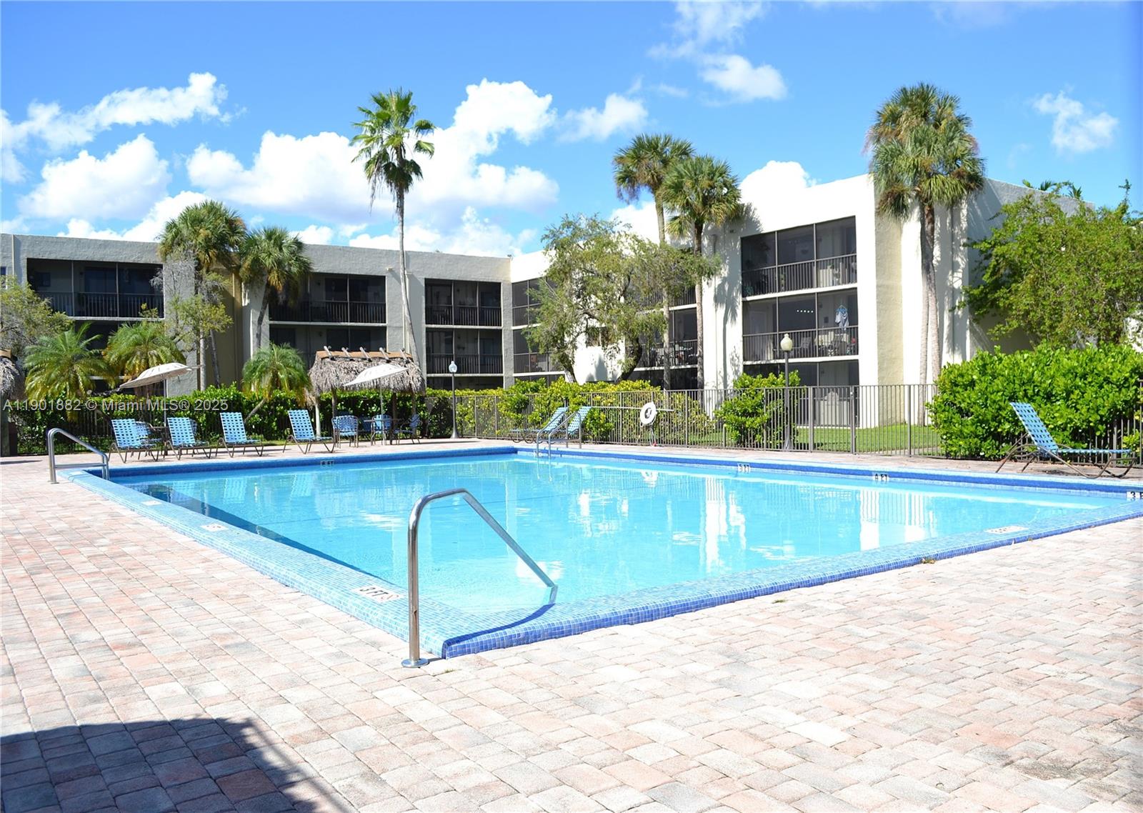 8045 Southwest 107th Avenue, Unit 303 Miami, FL 33173 - Photo 21 of 26 a view of swimming pool with outdoor seating and plants