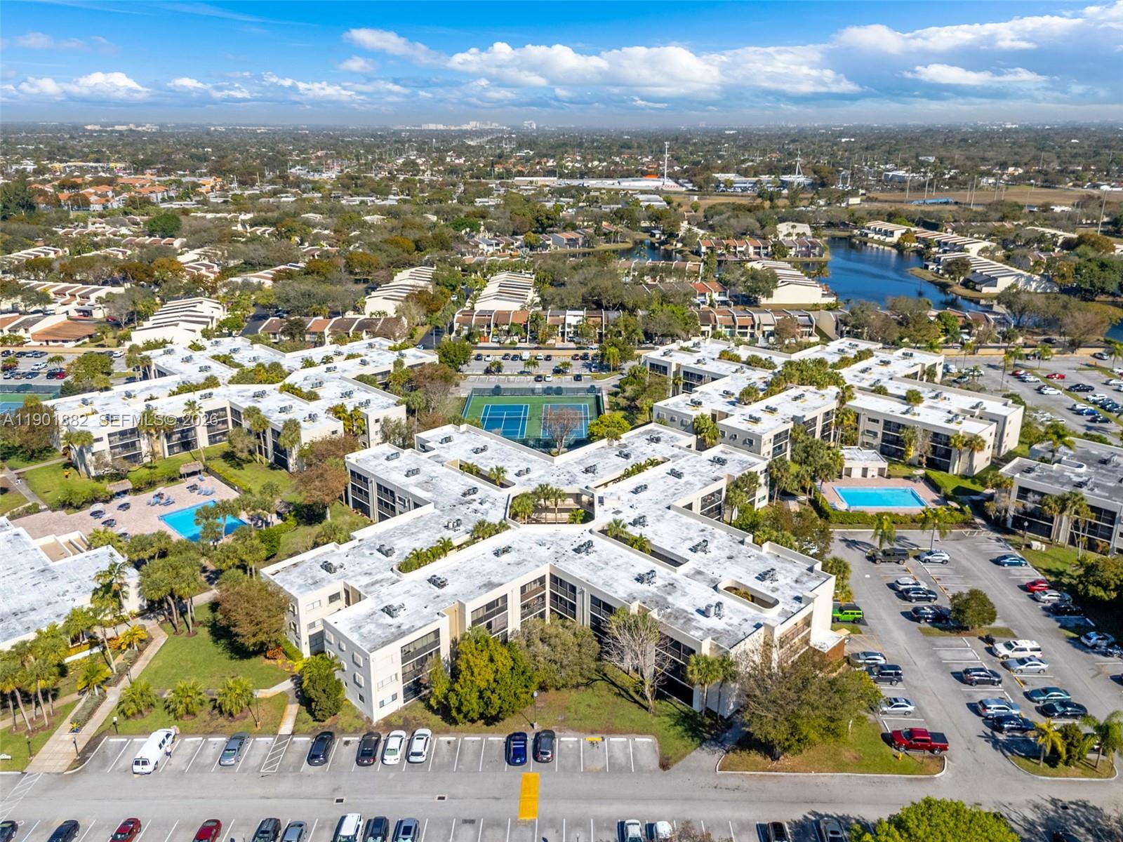 8045 Southwest 107th Avenue, Unit 303 Miami, FL 33173 - Photo 28 of 37 an aerial view of residential houses with outdoor space
