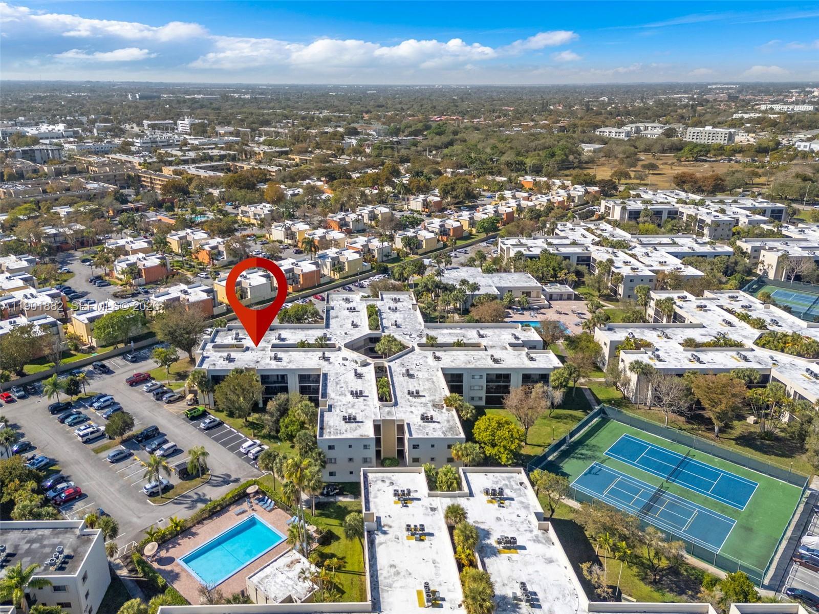 8045 Southwest 107th Avenue, Unit 303 Miami, FL 33173 - Photo 33 of 37 an aerial view of residential houses with city view
