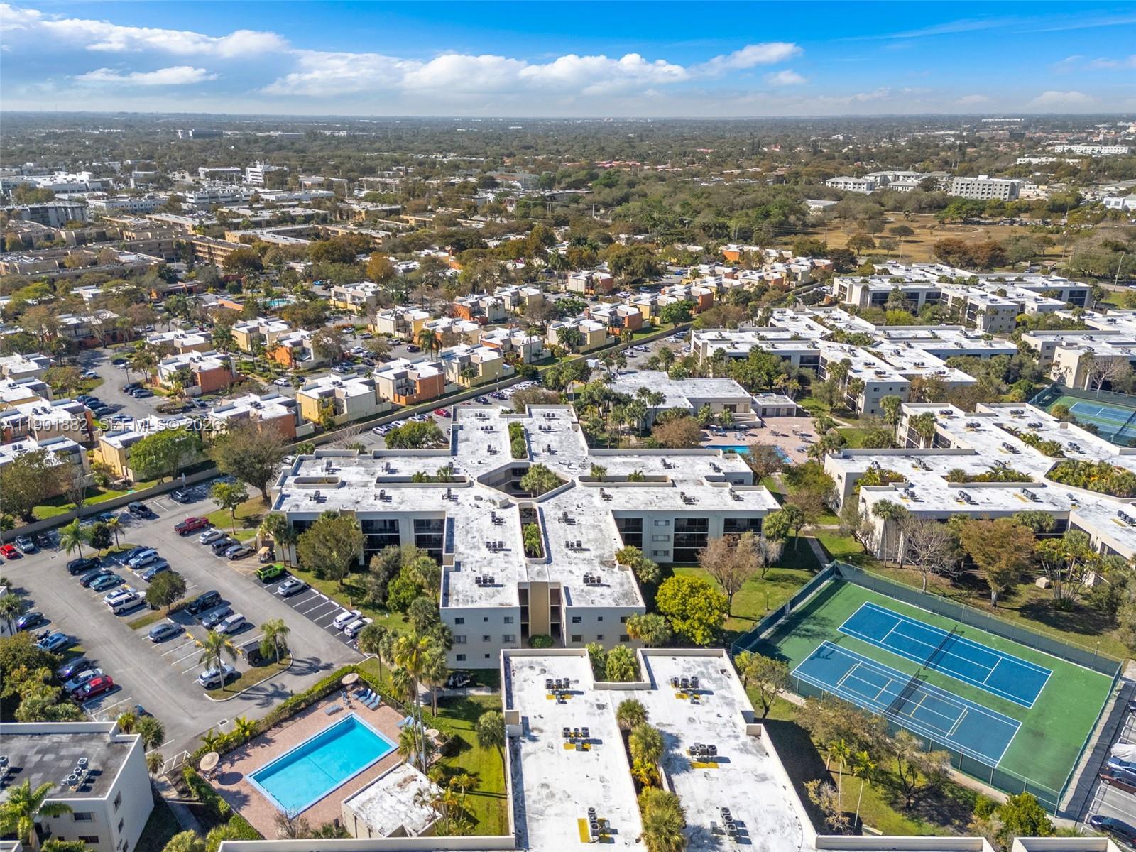 8045 Southwest 107th Avenue, Unit 303 Miami, FL 33173 - Photo 34 of 37 an aerial view of residential houses with city view