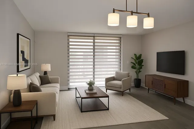 a living room with furniture chandelier and a flat screen tv