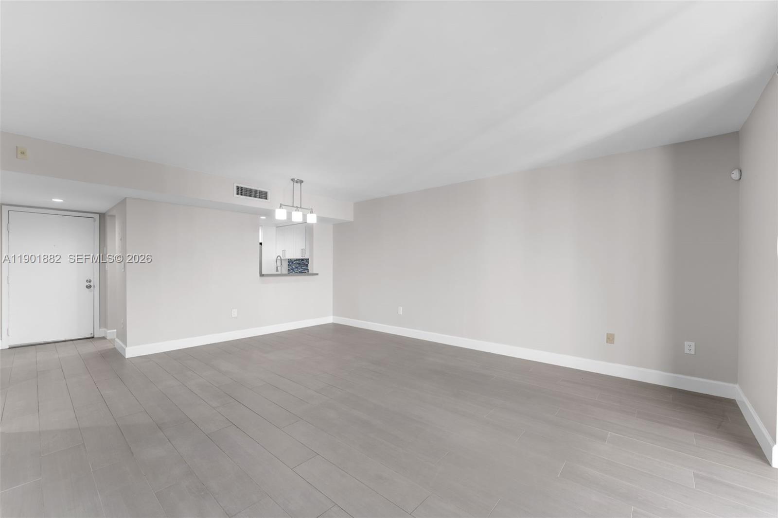 8045 Southwest 107th Avenue, Unit 303 Miami, FL 33173 - Photo 9 of 37 wooden floor in an empty room