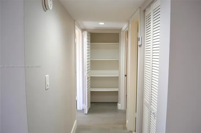 a view of an empty room and a window