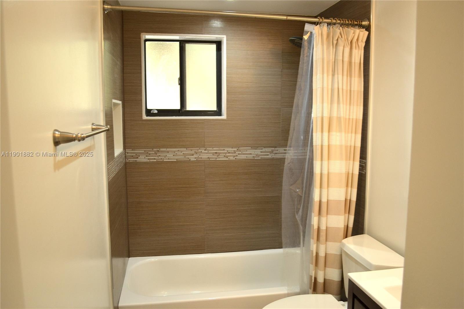 8045 Southwest 107th Avenue, Unit 303 Miami, FL 33173 - Photo 10 of 26 a bathroom with a bathtub and shower