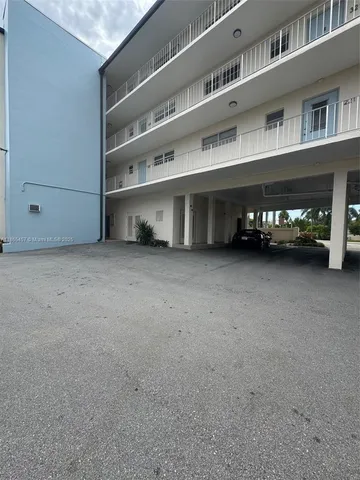 a view of a big room with windows