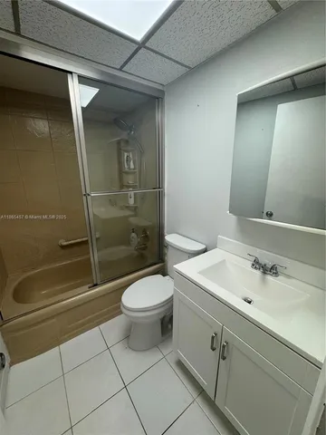 a bathroom with a shower and a toilet