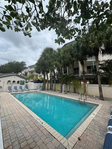 a view of a swimming pool with a patio