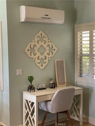 a view of a dining room with furniture and window