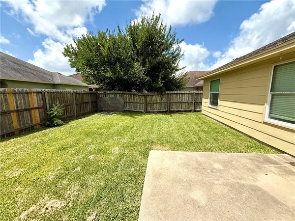 a view of a backyard with a small cabin