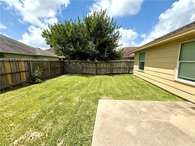 a view of a backyard with a small cabin