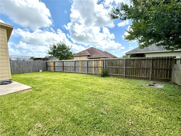 a view of a backyard with a small cabin