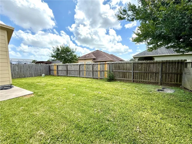 a view of a backyard with a small cabin