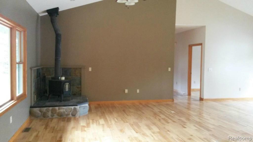 13140 West Albain Road Petersburg, MI 49270 - Photo 3 of 22 Living Room with Wood Stove
