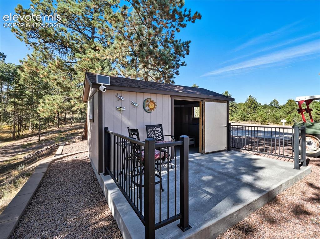 12855 Murphy Road Elbert, CO 80106 - Photo 41 of 50 a view of a house with wooden deck front of house