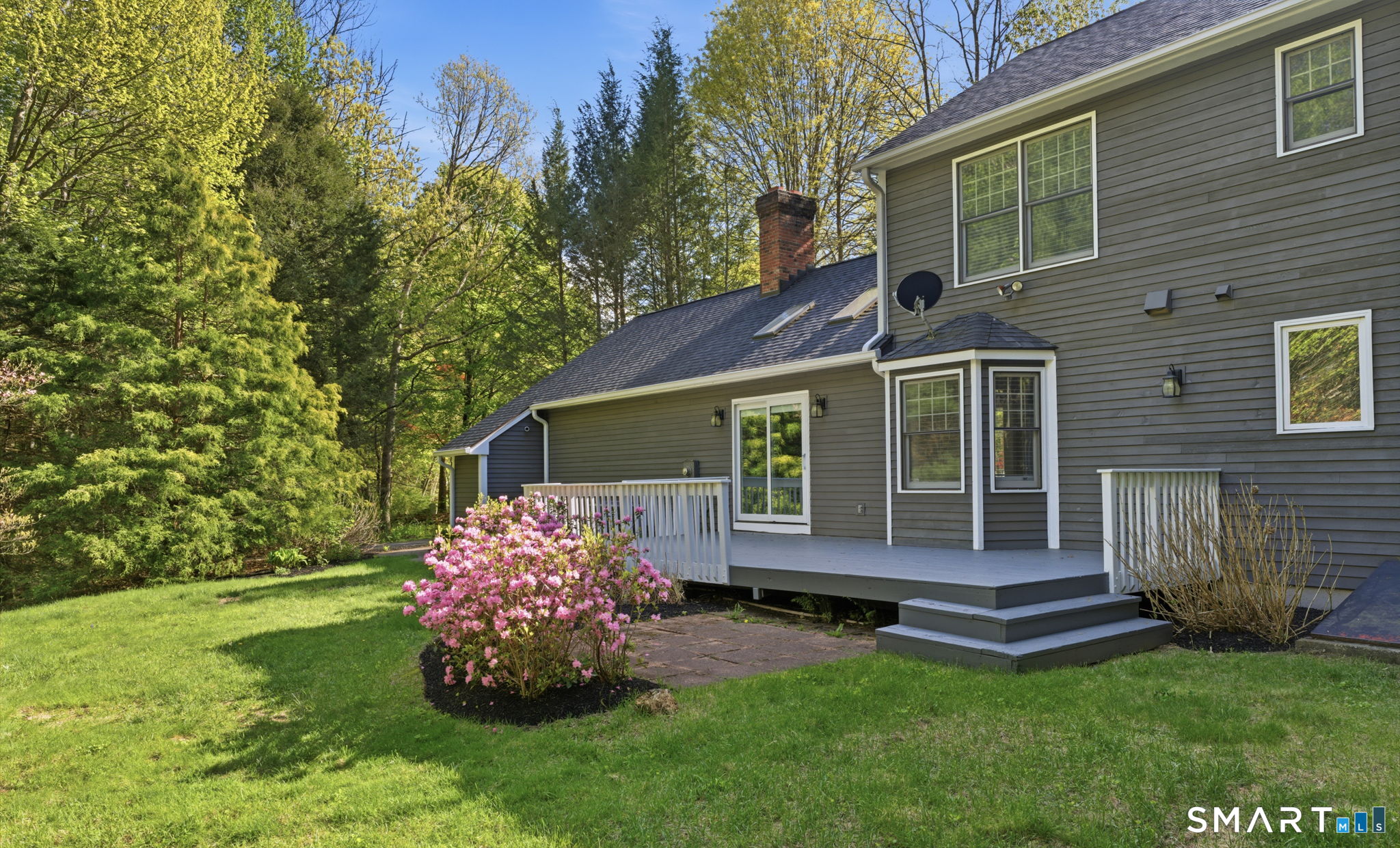 21 Greenwood Road North Granby, CT 06060 - Photo 33 of 40 a view of a house with a yard and a garden