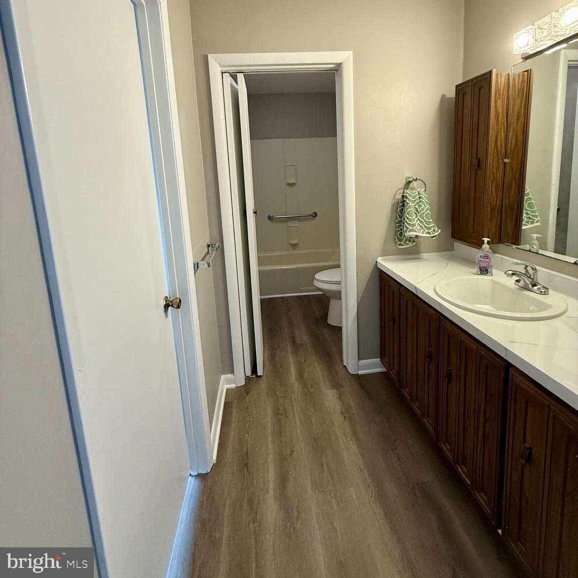 1643 Pennington Road Ewing, NJ 08618 - Photo 11 of 12 a bathroom with a double vanity sink and a mirror