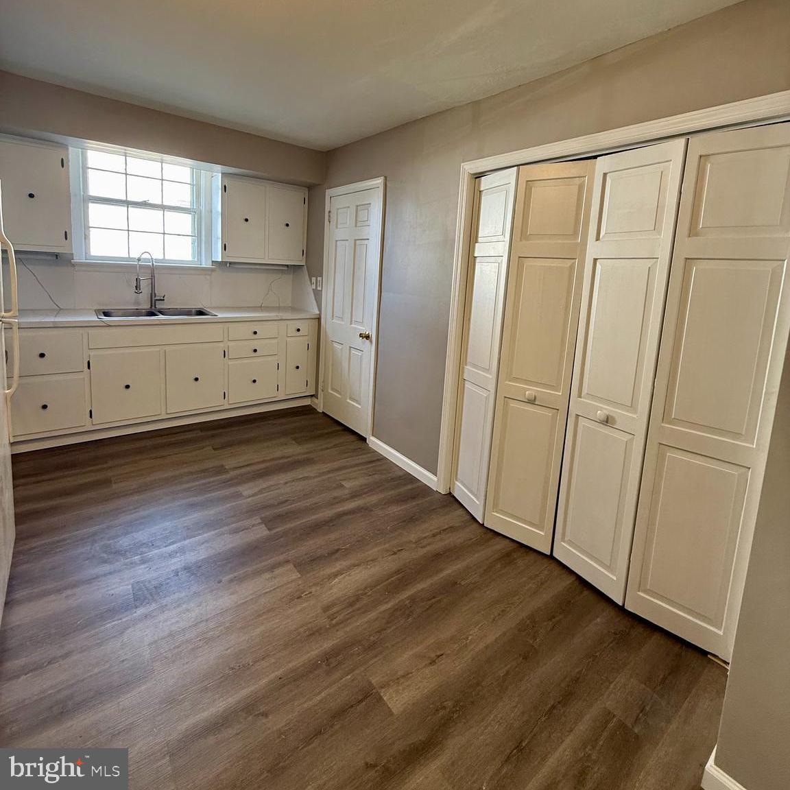 1643 Pennington Road Ewing, NJ 08618 - Photo 6 of 12 a view of a kitchen with wooden floor
