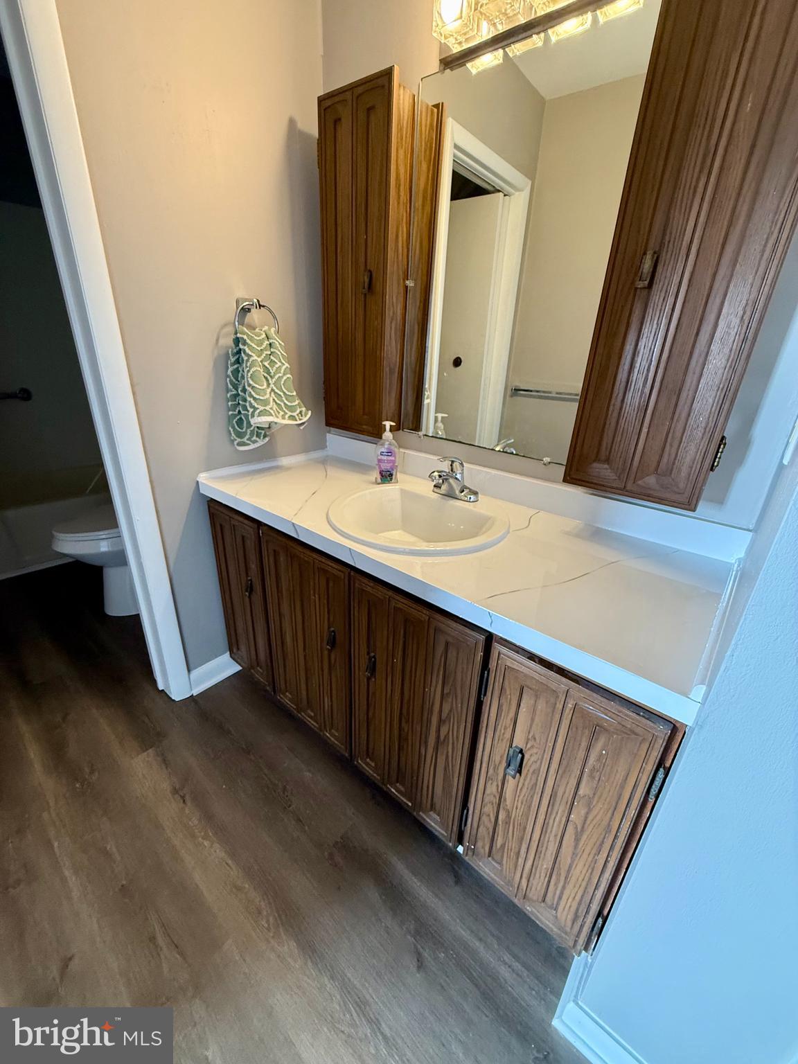 1643 Pennington Road Ewing, NJ 08618 - Photo 10 of 12 a bathroom with a double vanity sink and a mirror