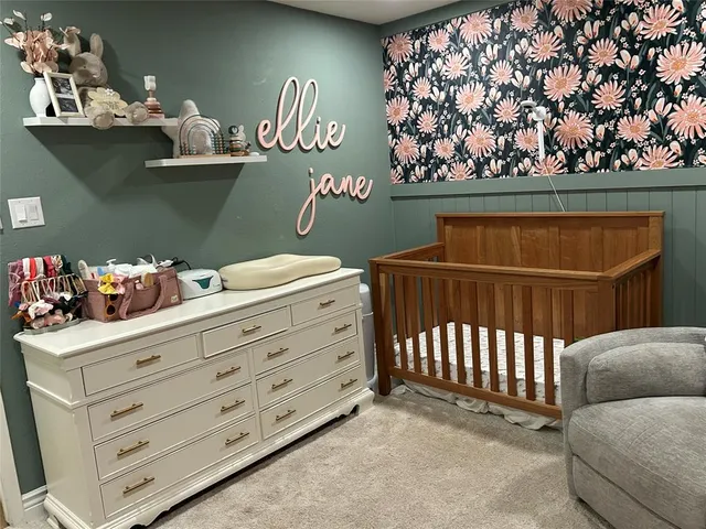 a view of a room with furniture and wooden floor