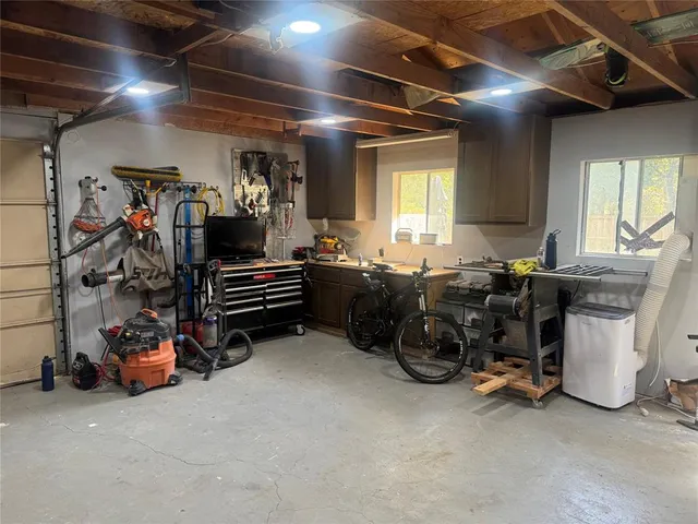 a room with gym equipment and a large window