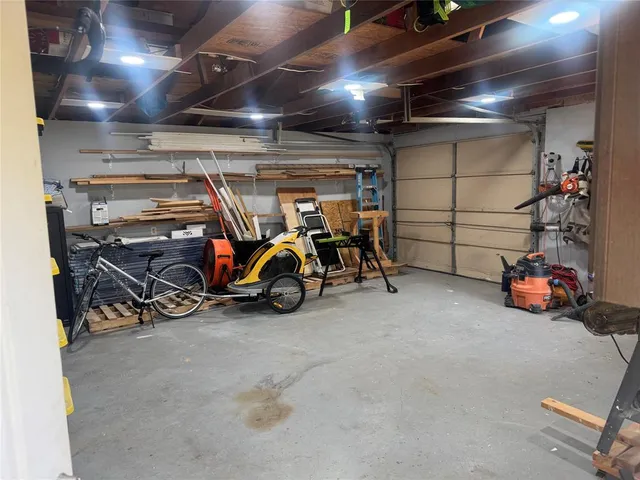 a view of a garage with parked cars