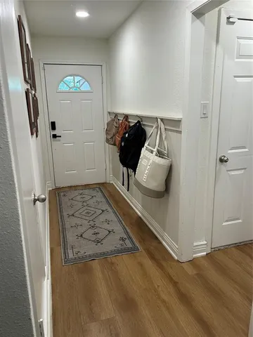 a view of hallway with seating area