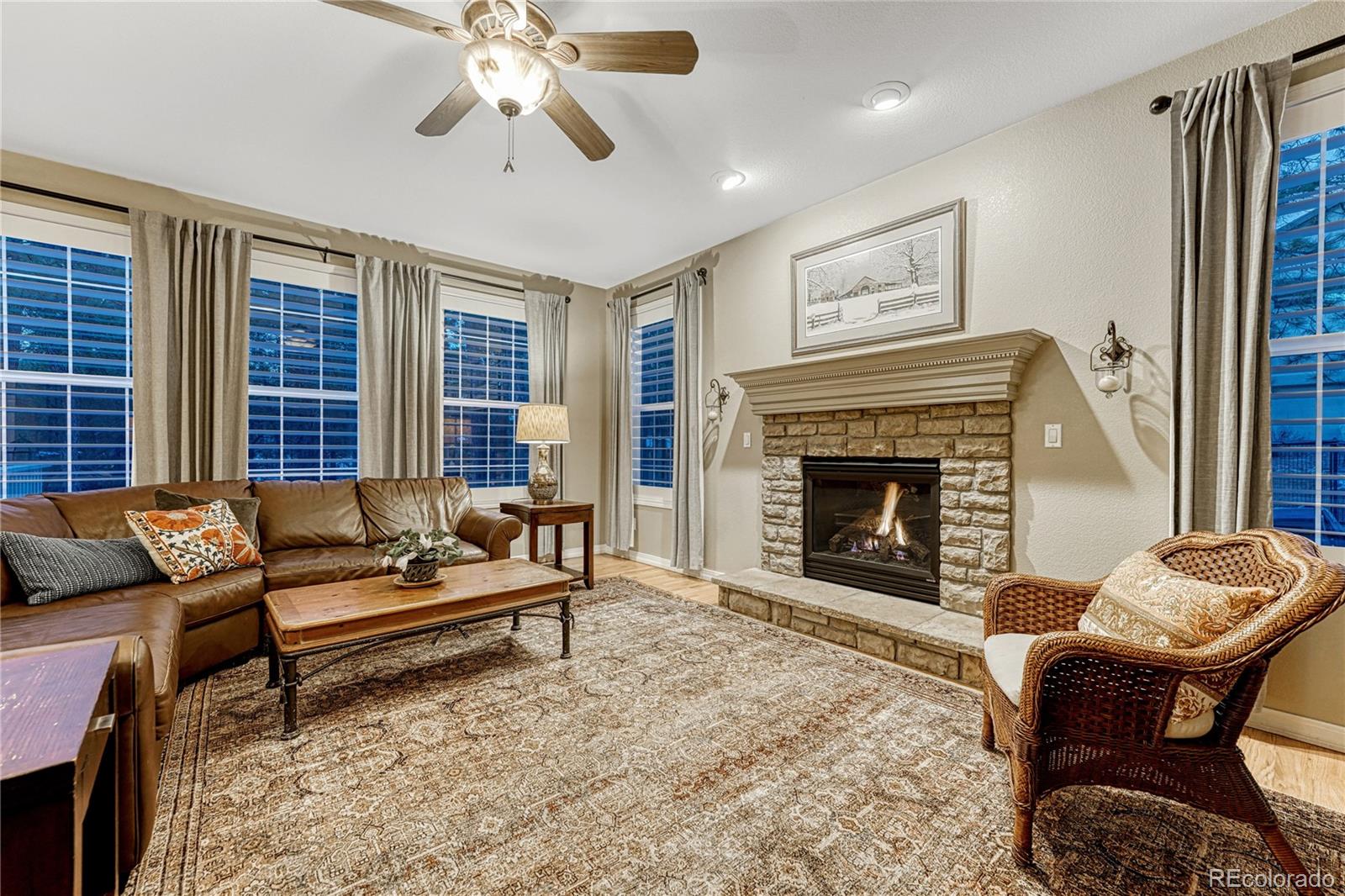 18150 Bakers Farm Road Colorado Springs, CO 80908 - Photo 12 of 49 a living room with furniture and a fireplace