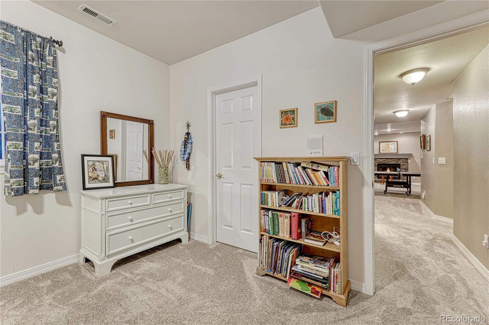 18150 Bakers Farm Road Colorado Springs, CO 80908 - Photo 29 of 49 a view of living room and workspace