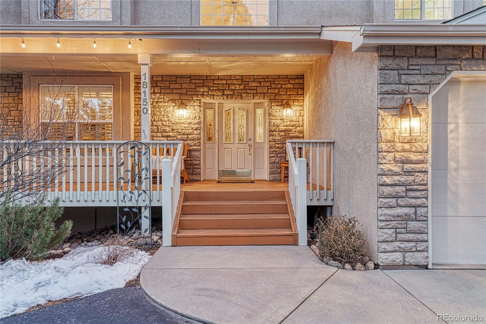 18150 Bakers Farm Road Colorado Springs, CO 80908 - Photo 3 of 49 a view of entryway with a front door