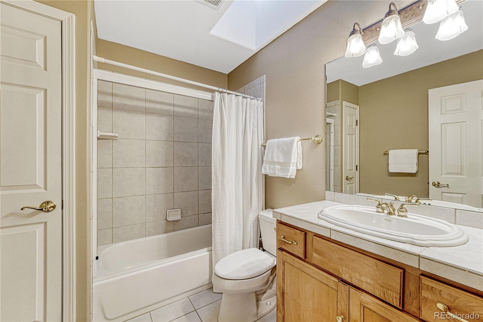 18150 Bakers Farm Road Colorado Springs, CO 80908 - Photo 36 of 49 a bathroom with a sink toilet and shower