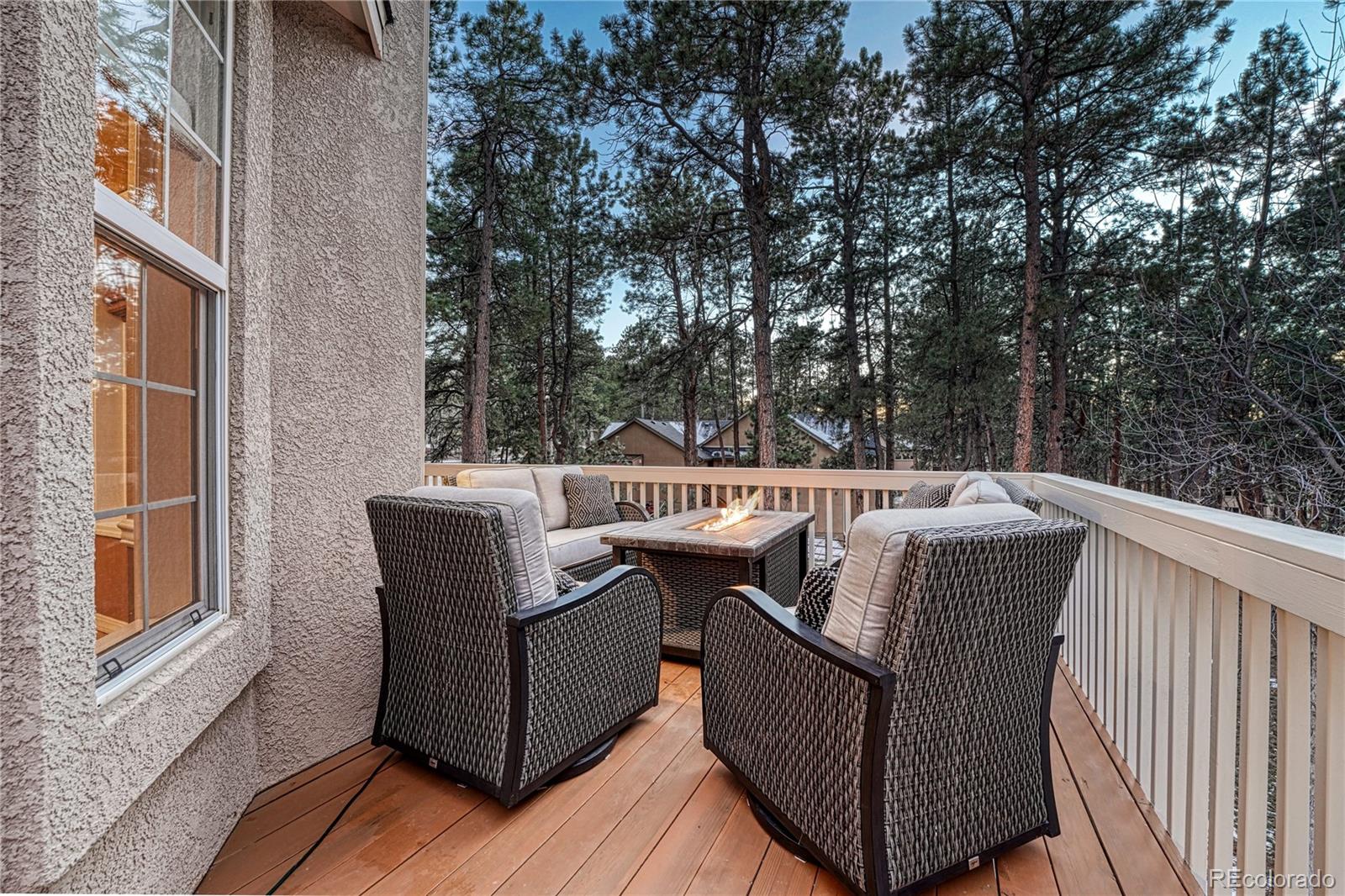 18150 Bakers Farm Road Colorado Springs, CO 80908 - Photo 38 of 49 a view of a couches in the balcony