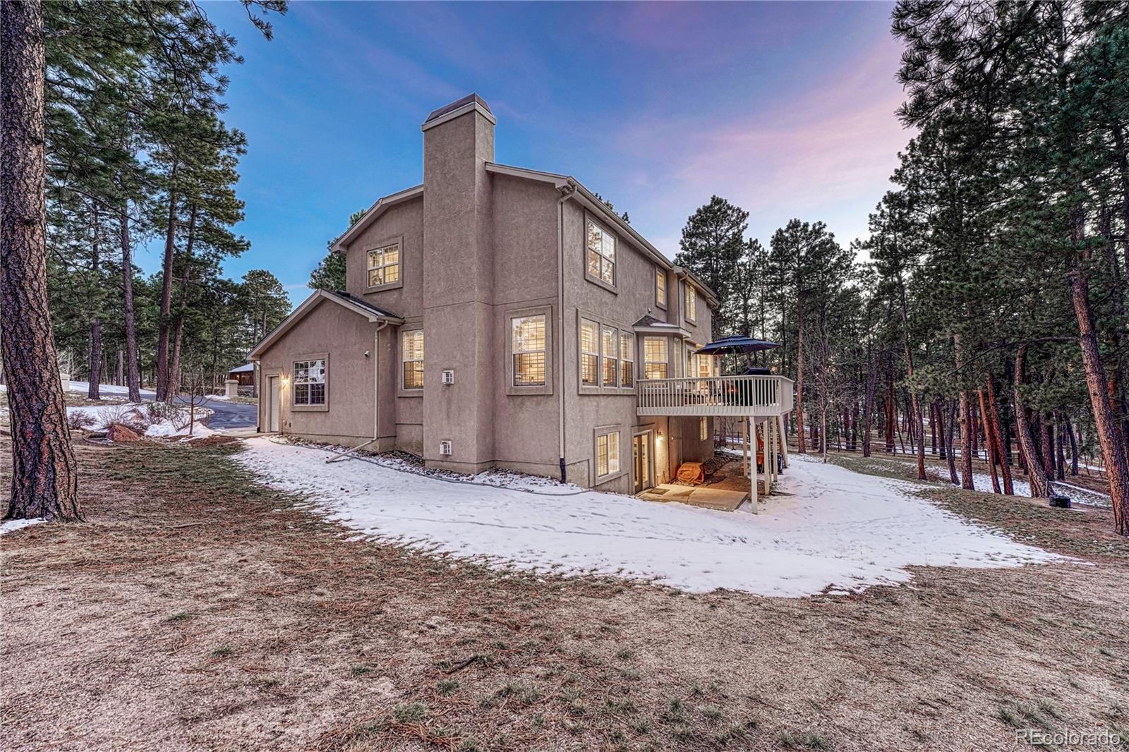 18150 Bakers Farm Road Colorado Springs, CO 80908 - Photo 40 of 49 a view of a house with a snow yard