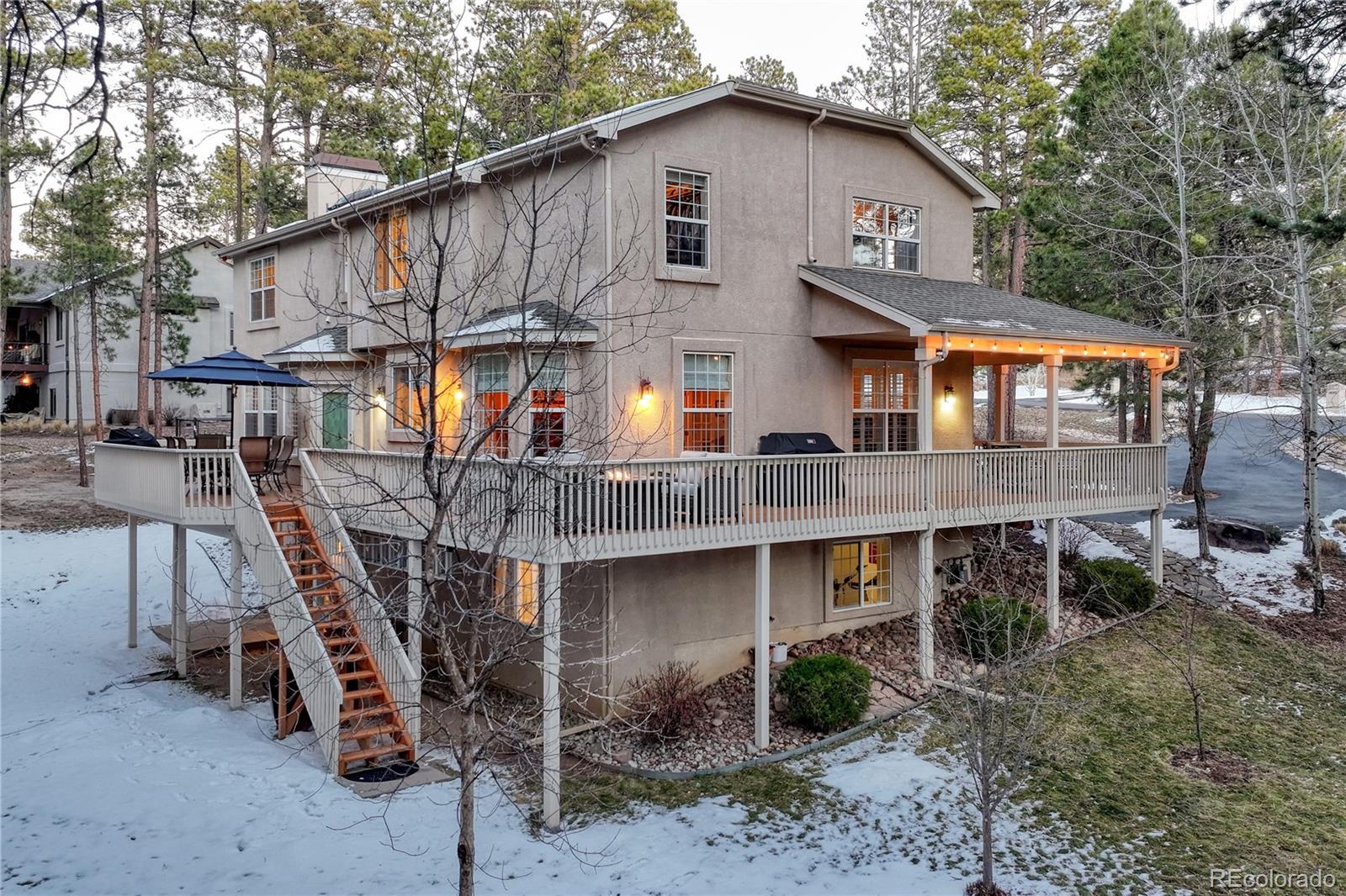 18150 Bakers Farm Road Colorado Springs, CO 80908 - Photo 44 of 49 a front view of house with deck and outdoor seating
