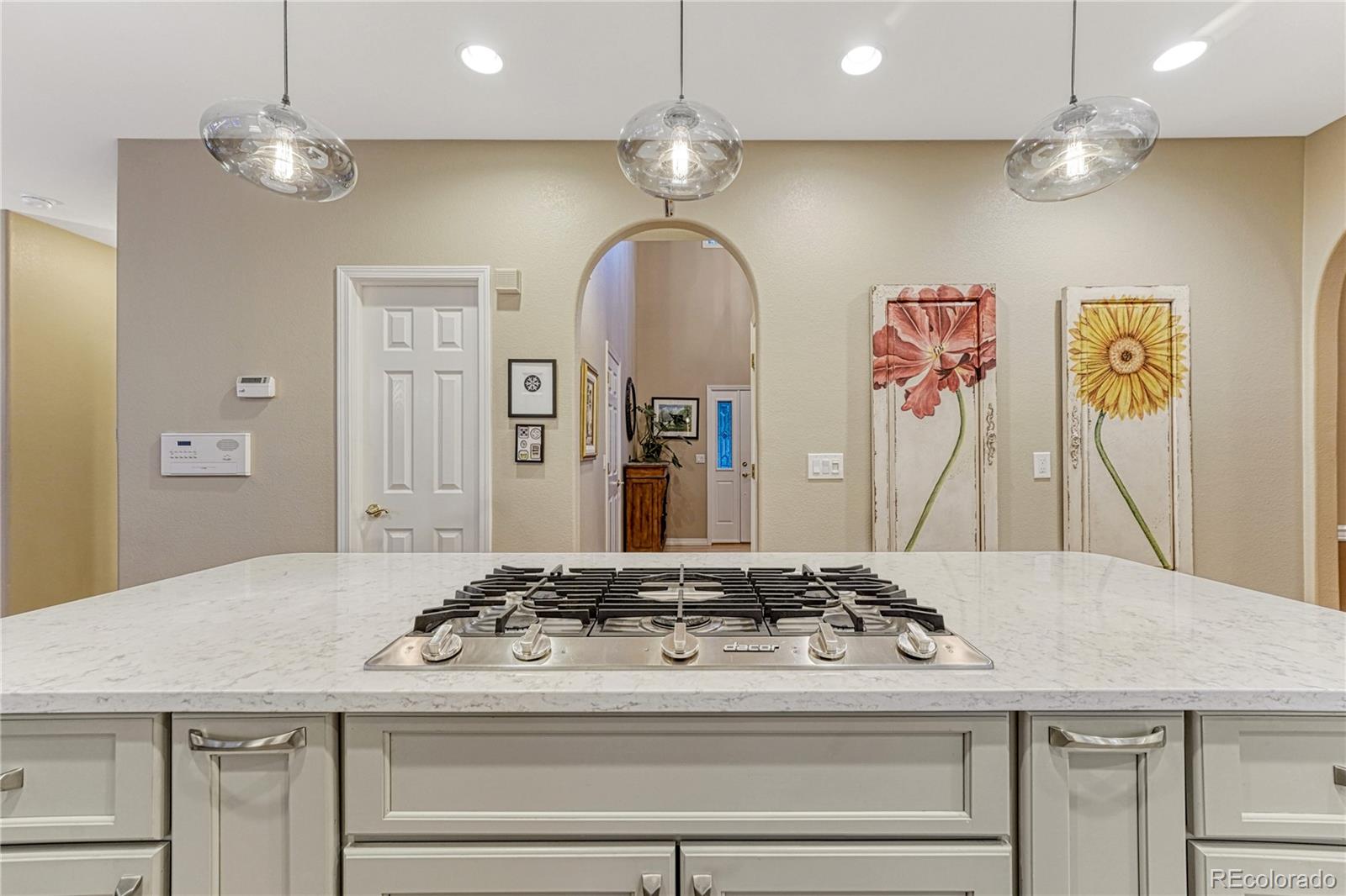 18150 Bakers Farm Road Colorado Springs, CO 80908 - Photo 9 of 49 a view of kitchen with kitchen island stainless steel appliances and chandelier