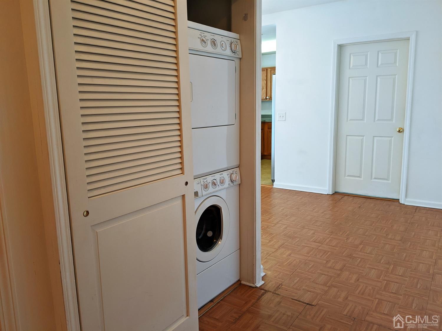 358 Rector Street, Unit 504 Perth Amboy, NJ 08861 - Photo 7 of 18 a utility room with dryer and washer