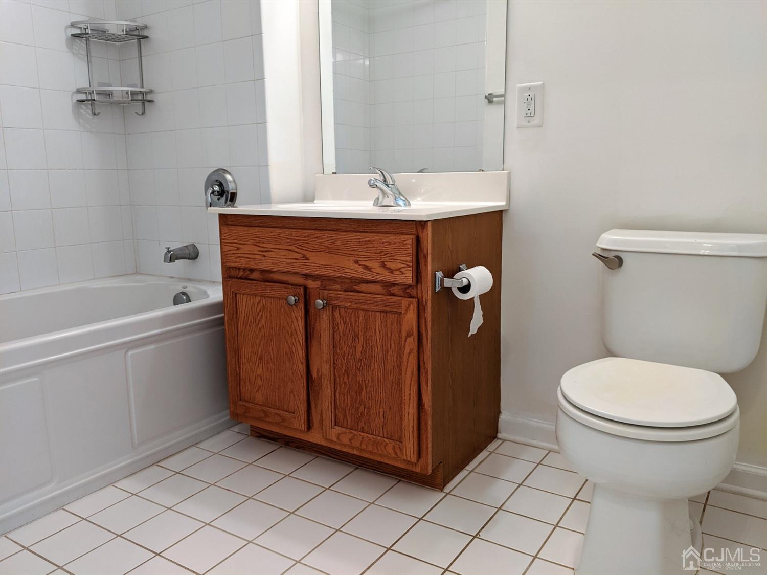 358 Rector Street, Unit 504 Perth Amboy, NJ 08861 - Photo 9 of 18 a bathroom with a granite countertop toilet and a sink
