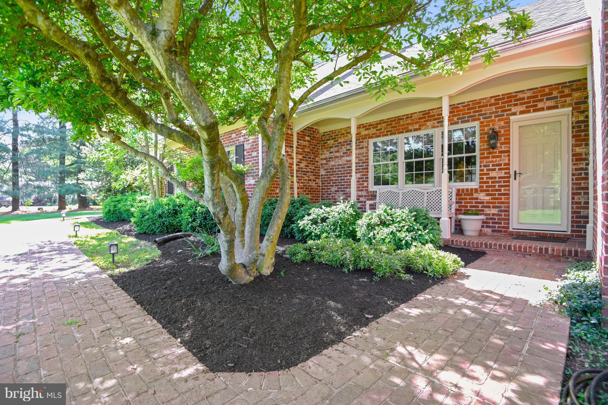13402 Cambria Farms Road Phoenix, MD 21131 - Photo 2 of 28 a front view of a house with garden
