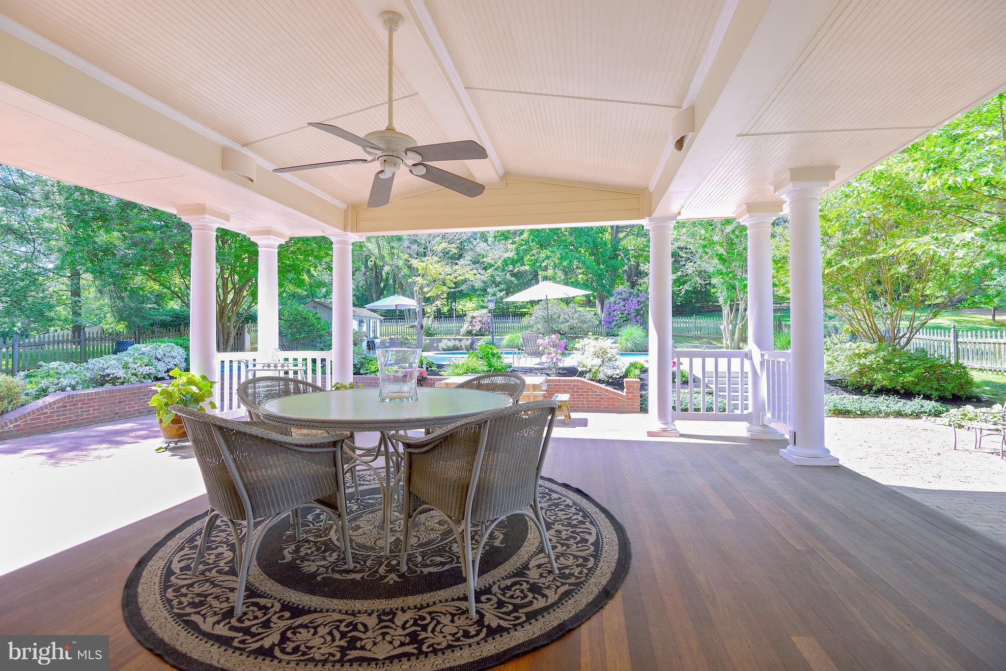 13402 Cambria Farms Road Phoenix, MD 21131 - Photo 3 of 28 a view of a dining room with furniture wooden floor and garden view