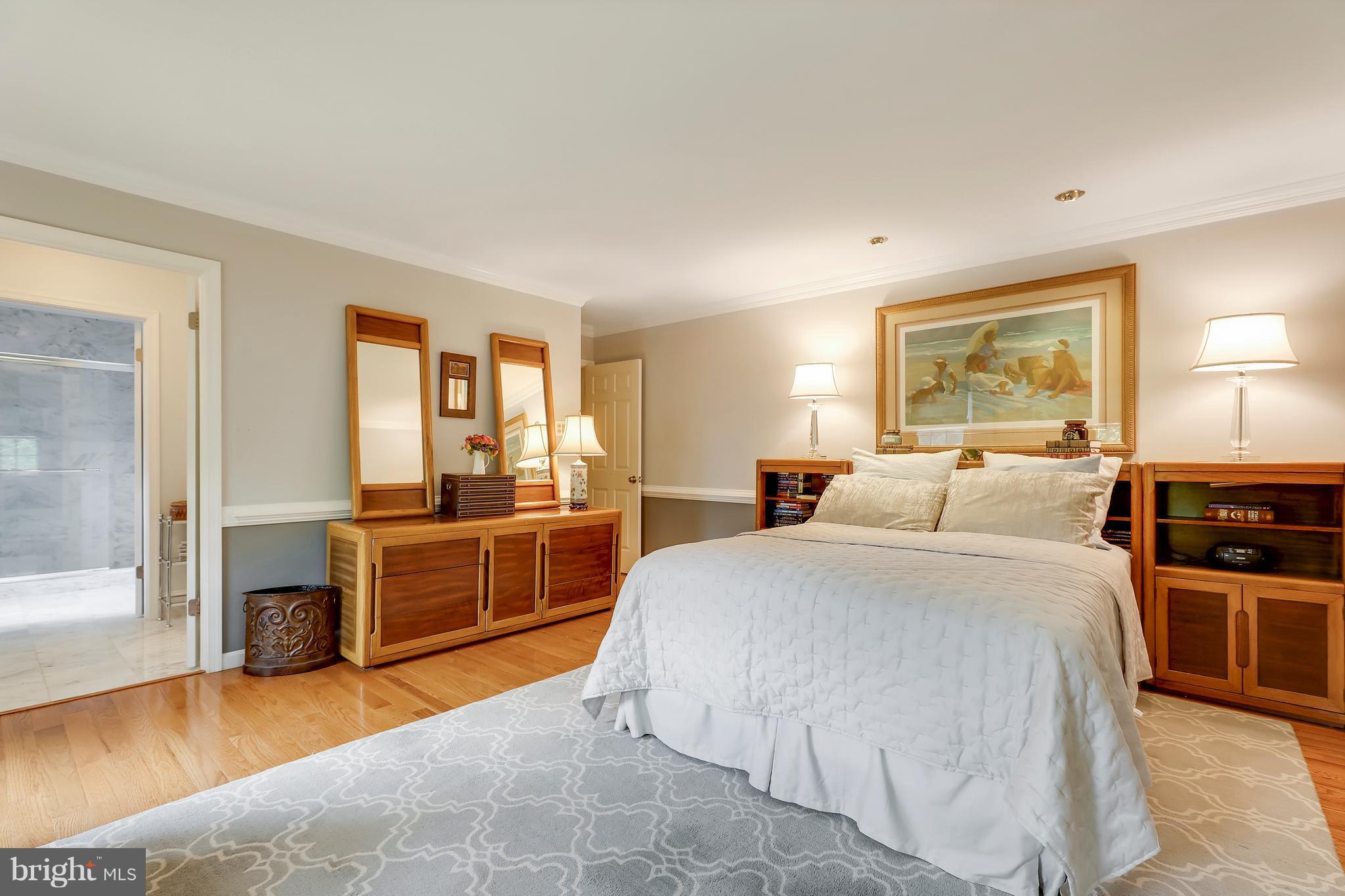 13402 Cambria Farms Road Phoenix, MD 21131 - Photo 21 of 28 a bed room with a bed and a television