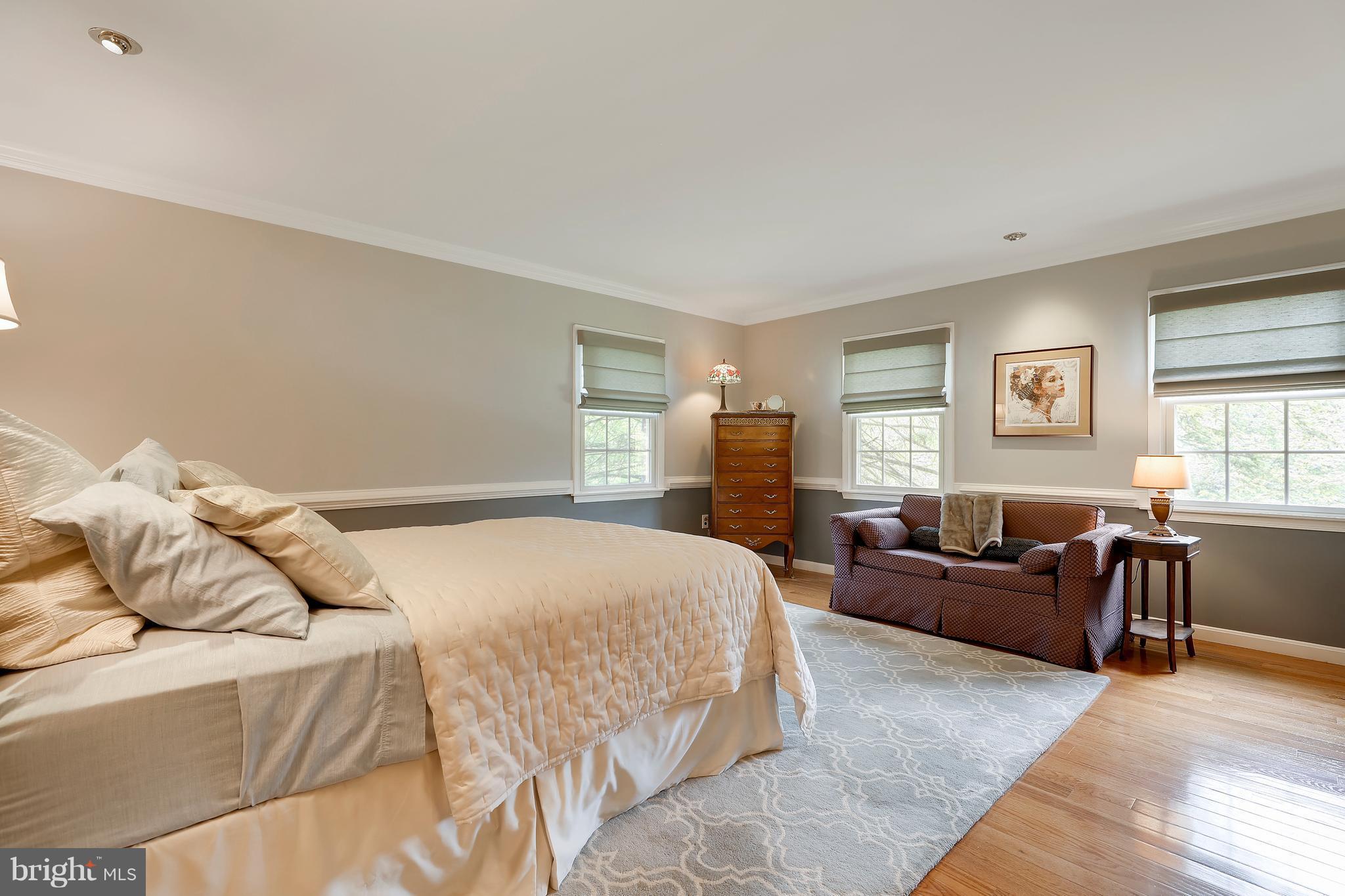 13402 Cambria Farms Road Phoenix, MD 21131 - Photo 22 of 28 a bedroom with a bed and a couch