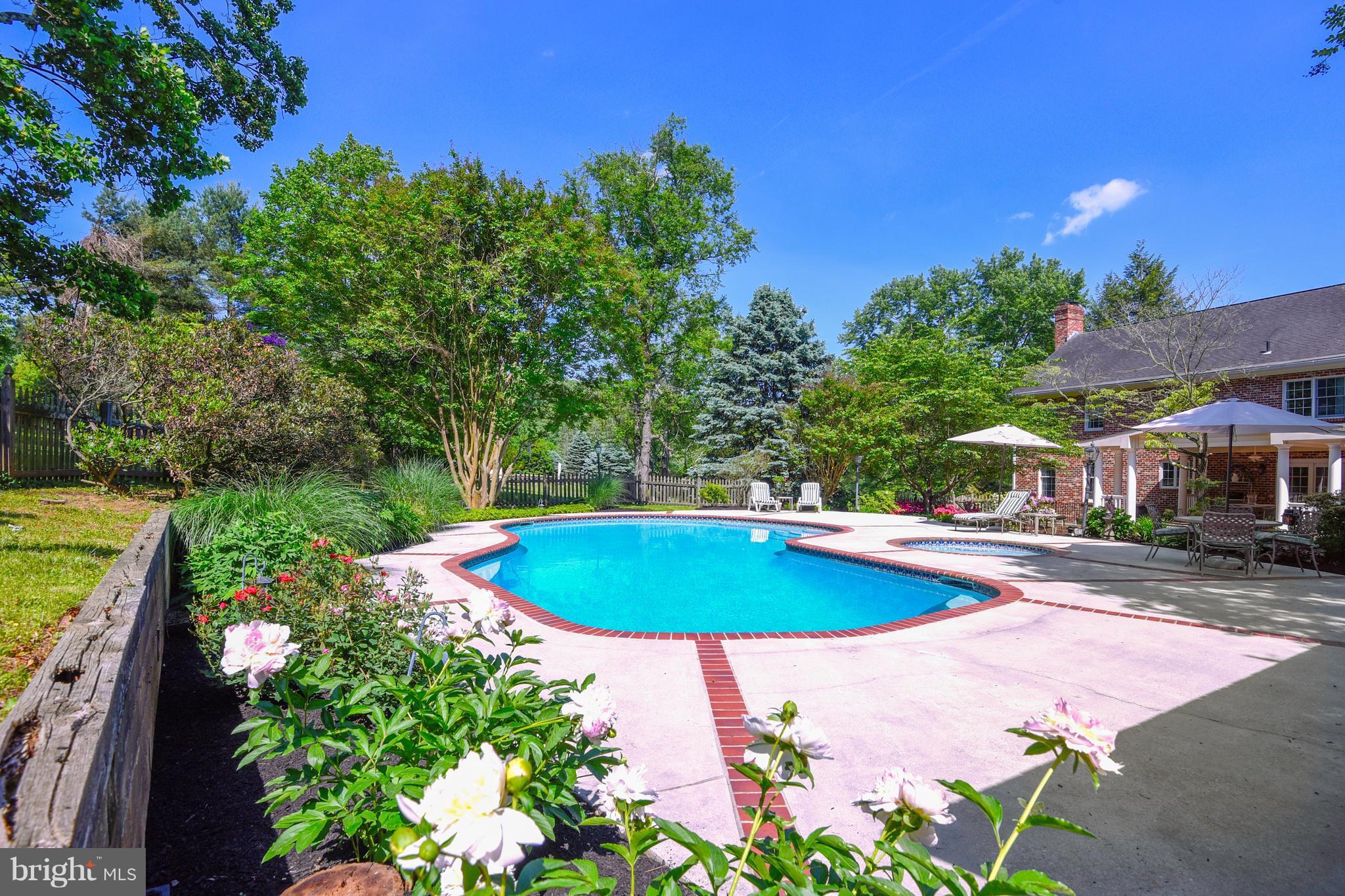 13402 Cambria Farms Road Phoenix, MD 21131 - Photo 4 of 28 a view of a swimming pool with a patio