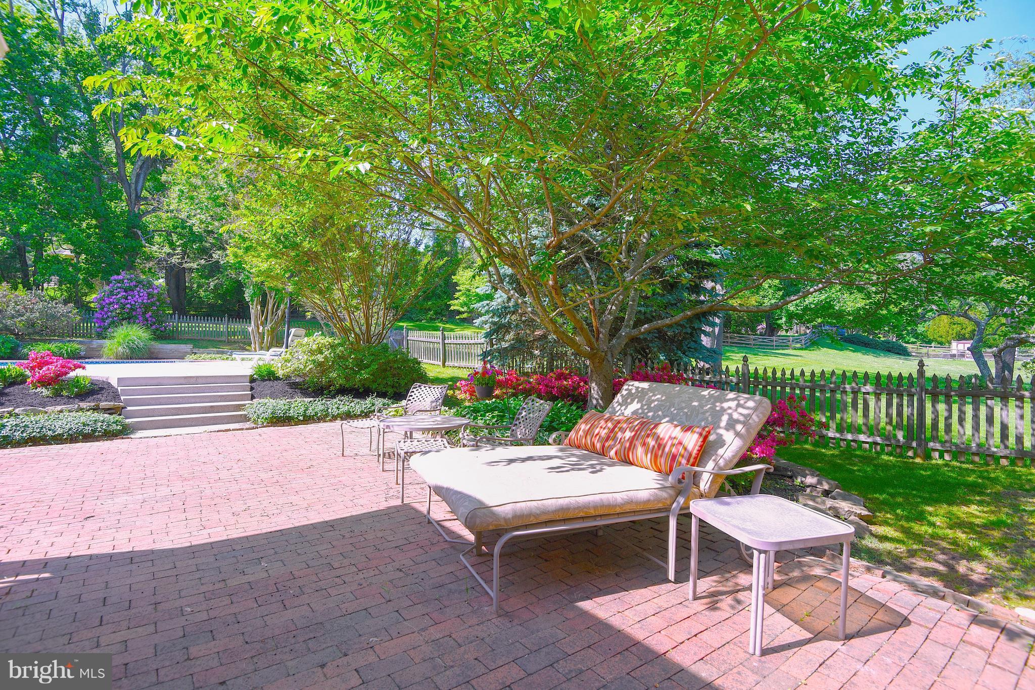 13402 Cambria Farms Road Phoenix, MD 21131 - Photo 6 of 28 a backyard of a house with yard and outdoor seating