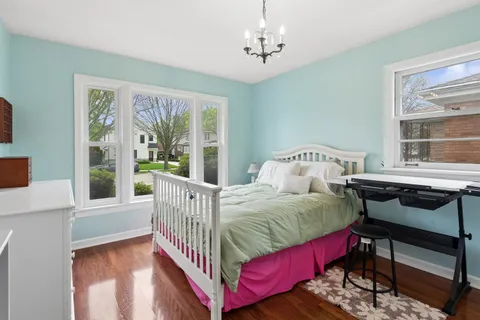 a bedroom with a bed and a table in it
