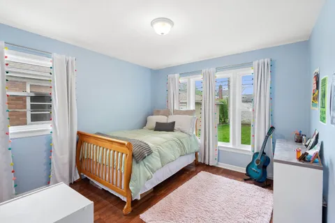 a bed room with a bed and a window