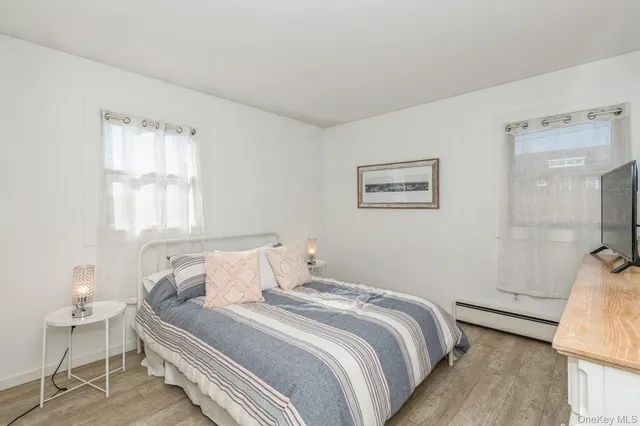 a bedroom with a bed and a chair