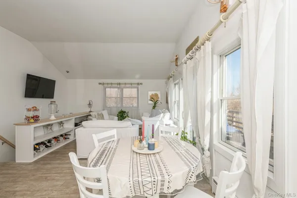 a view of a dining room with furniture window and outside view