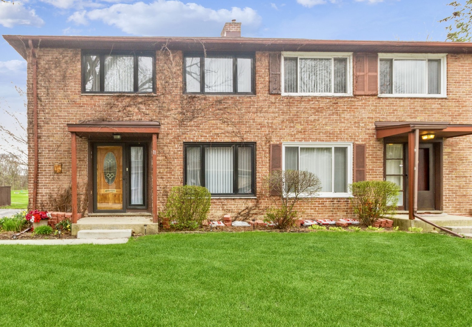 11 Dunlap Road Park Forest, IL 60466 - Photo 1 of 12 front view of a house with potted plants