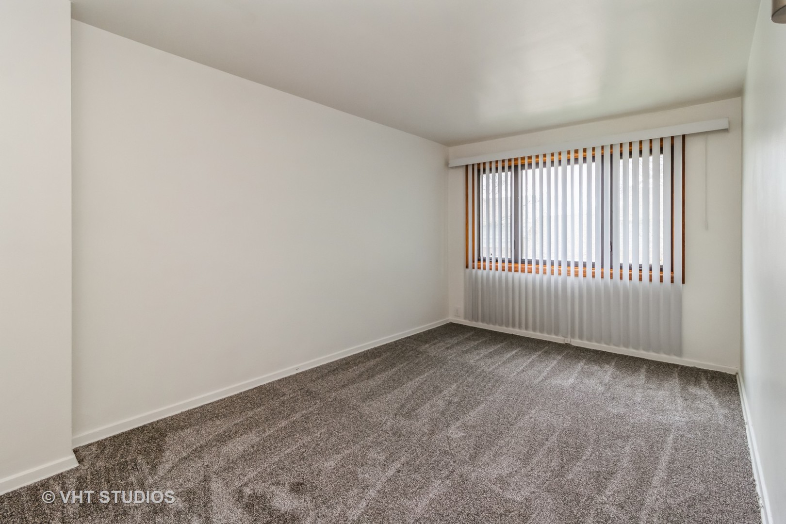 11 Dunlap Road Park Forest, IL 60466 - Photo 7 of 12 wooden floor in an empty room with a window